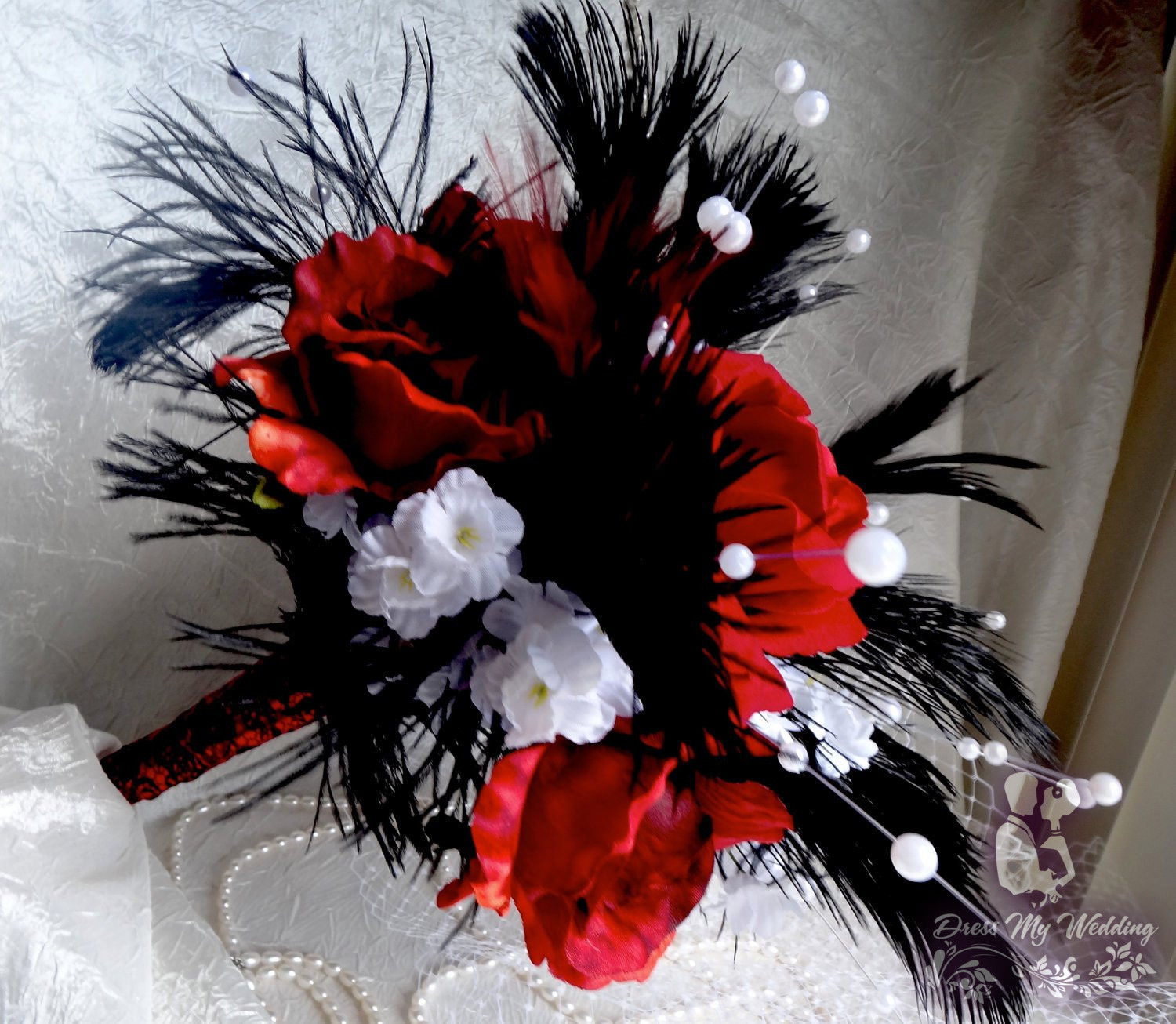 red rose bouquet with feathers